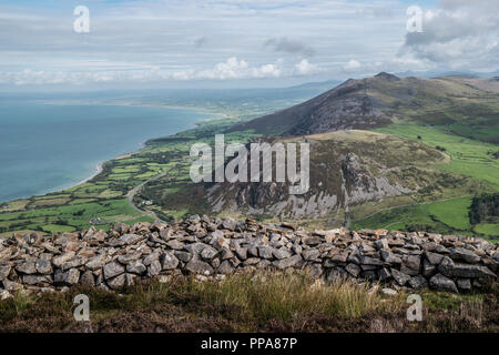 Tre`r Ceiri Hillfort and Yr Eifl showing stone huts, North Wales, UK Stock Photo